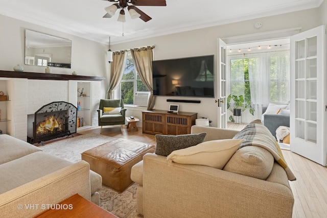 5245 N Winthrop Ave Unit 3S, Chicago, IL 60640 - living area with a ceiling fan, wood finished floors, ornamental molding, and a brick fireplace