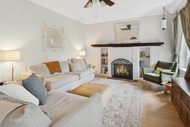5245 N Winthrop Ave Unit 3S, Chicago, IL 60640 - living room featuring ceiling fan, ornamental molding, wood finished floors, and a fireplace