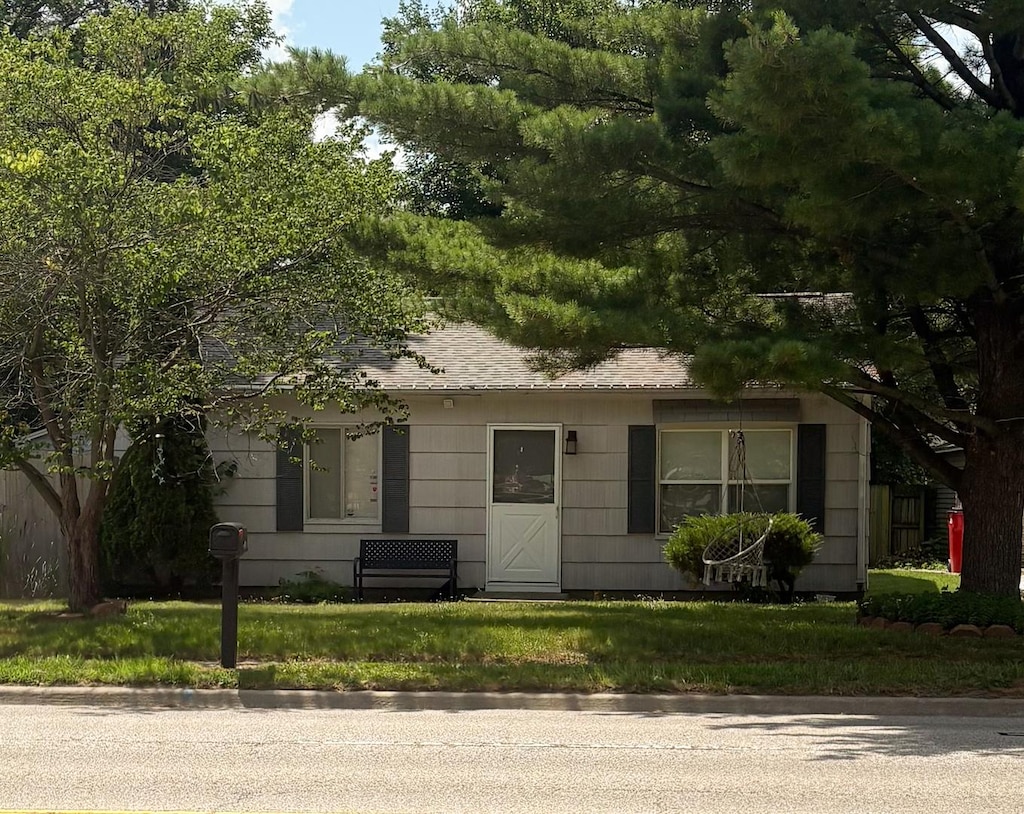 2203 W Kirby Ave, Champaign, IL 61821 - view of front of house featuring roof with shingles
