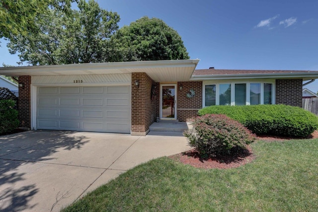 1213 Rose Ct, Bartlett, IL 60103 - ranch-style house featuring concrete driveway, brick siding, and an attached garage