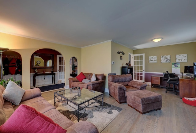 1213 Rose Ct, Bartlett, IL 60103 - living room featuring french doors, arched walkways, an office area, wood finished floors, and ornamental molding