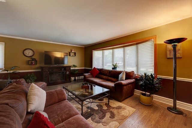1213 Rose Ct, Bartlett, IL 60103 - living area featuring wood finished floors, ornamental molding, and a glass covered fireplace