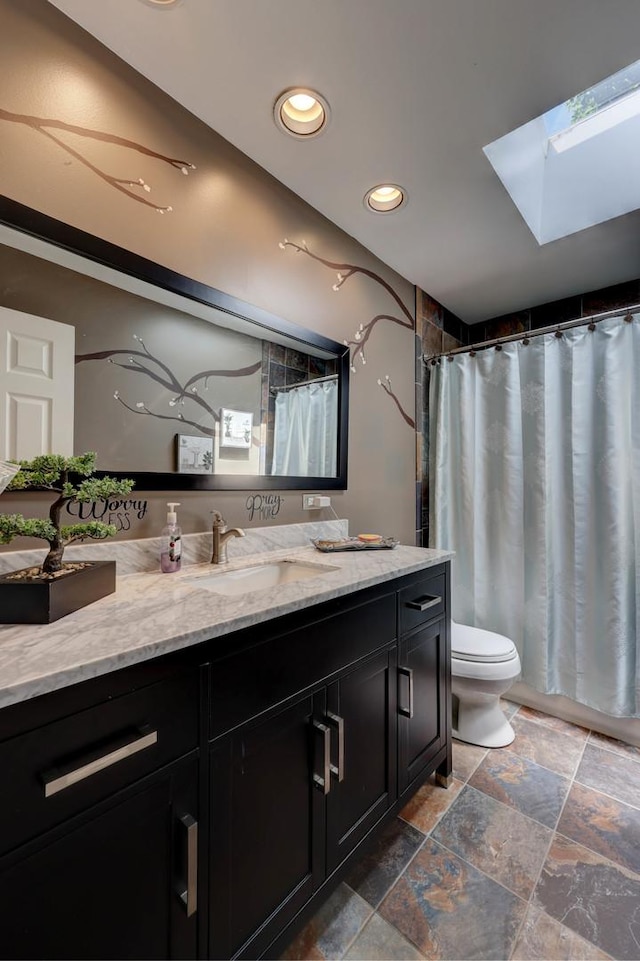 1213 Rose Ct, Bartlett, IL 60103 - full bathroom with a skylight, vanity, stone tile floors, recessed lighting, and a shower with shower curtain