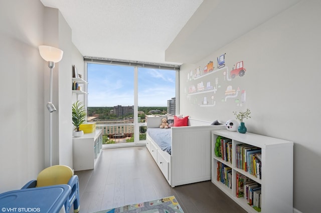 800 Elgin Rd Unit 1406, Evanston, IL 60201 - bedroom featuring wood finished floors and a wall of windows