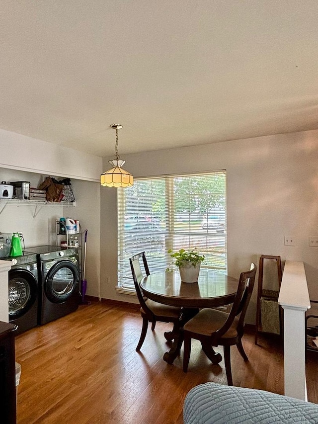 14155 S Hemingway Cir, Plainfield, IL 60544 - dining area with washer and clothes dryer and wood finished floors