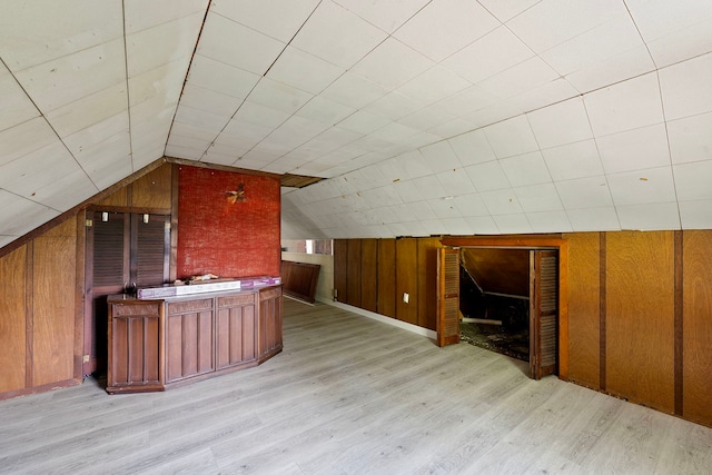 2421 W 21st Pl, Chicago, IL 60608 - bonus room featuring wood walls, light wood-style flooring, and vaulted ceiling