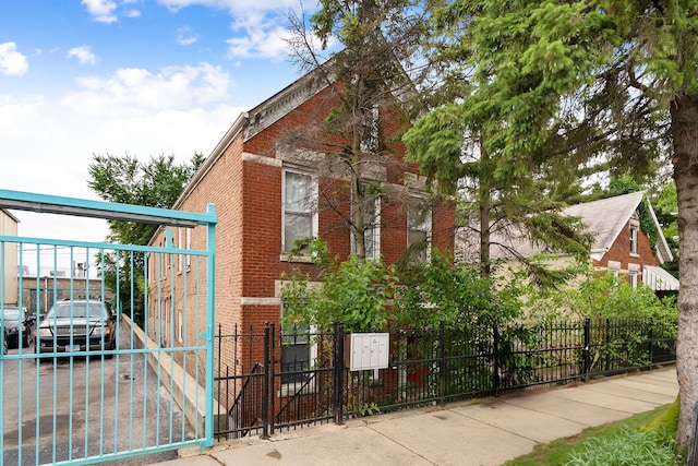 2421 W 21st Pl, Chicago, IL 60608 - view of home's exterior featuring brick siding and a fenced front yard