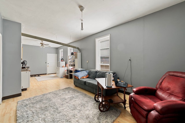 2421 W 21st Pl, Chicago, IL 60608 - living room with light wood-style floors, a ceiling fan, and water heater
