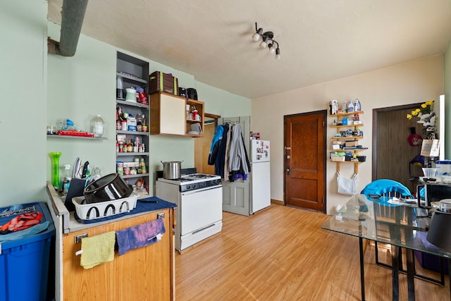 2421 W 21st Pl, Chicago, IL 60608 - kitchen featuring white appliances, open shelves, and light wood-type flooring