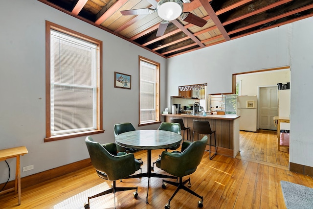 2421 W 21st Pl, Chicago, IL 60608 - dining room featuring a ceiling fan, light wood-type flooring, beam ceiling, and plenty of natural light