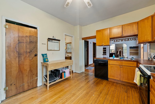 2421 W 21st Pl, Chicago, IL 60608 - kitchen with black dishwasher, range with electric cooktop, light wood-style flooring, brown cabinetry, and ceiling fan