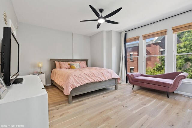 843 W College Pkwy, Chicago, IL 60608 - bedroom with light wood finished floors and a ceiling fan
