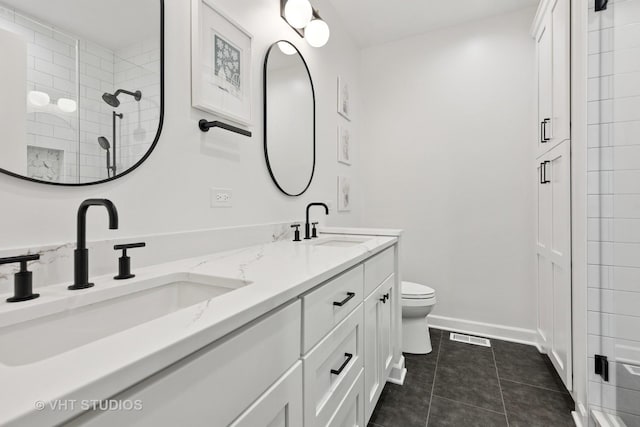 843 W College Pkwy, Chicago, IL 60608 - bathroom featuring double vanity, tile patterned flooring, and a tile shower
