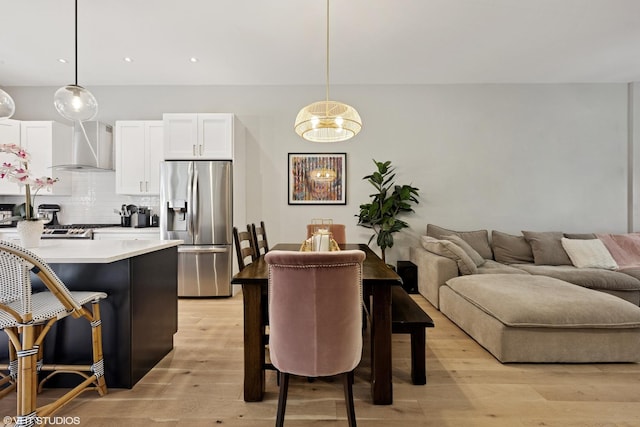 843 W College Pkwy, Chicago, IL 60608 - dining space featuring light wood finished floors and a chandelier
