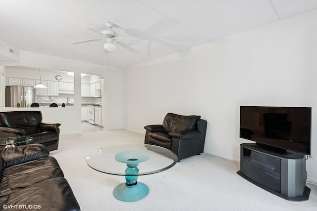5055 W Madison St Unit 411, Skokie, IL 60077 - living area with a ceiling fan and light colored carpet