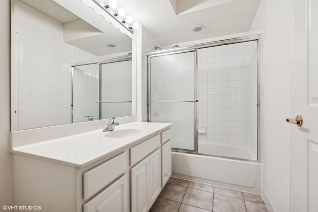 5055 W Madison St Unit 411, Skokie, IL 60077 - full bath with vanity, shower / bath combination with glass door, and tile patterned flooring