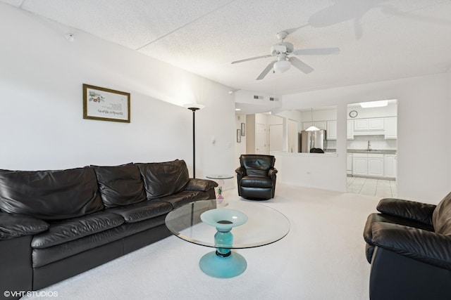 5055 W Madison St Unit 411, Skokie, IL 60077 - living area with ceiling fan, light carpet, and a textured ceiling