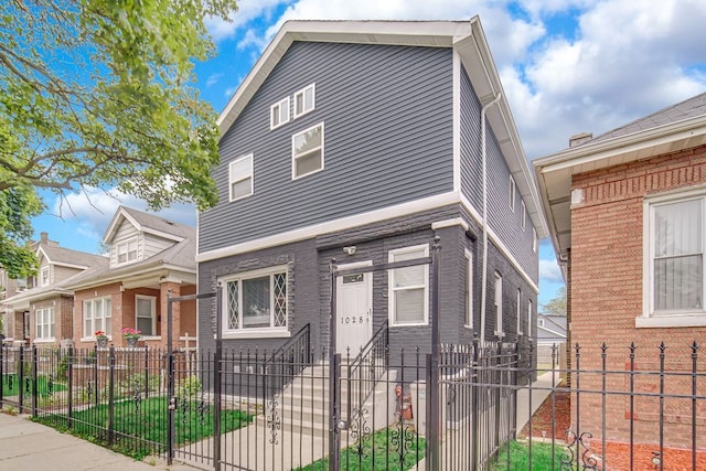1028 N Lavergne Ave, Chicago, IL 60651 - view of front of home with a fenced front yard and a gate