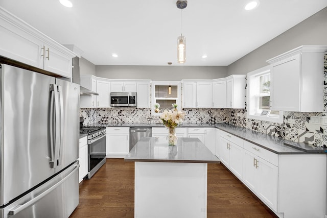 1028 N Lavergne Ave, Chicago, IL 60651 - kitchen with appliances with stainless steel finishes, decorative backsplash, white cabinets, and recessed lighting
