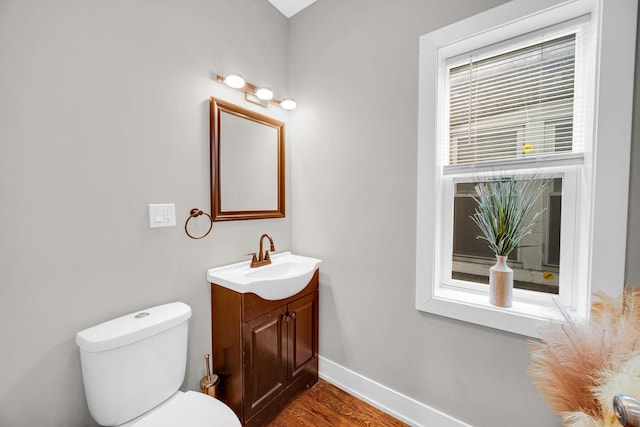 1028 N Lavergne Ave, Chicago, IL 60651 - half bathroom featuring vanity and wood finished floors