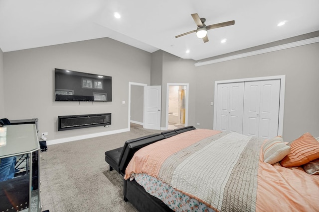 1028 N Lavergne Ave, Chicago, IL 60651 - carpeted bedroom featuring a glass covered fireplace, a closet, lofted ceiling, connected bathroom, and a ceiling fan
