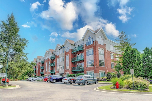 640 Mchenry Rd Unit 106, Wheeling, IL 60090 - view of apartment building / complex featuring uncovered parking