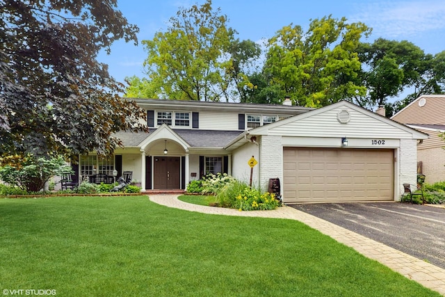 1502 S Fernandez Ave, Arlington Heights, IL 60005 - traditional-style house with driveway, a front lawn, a garage, and roof with shingles