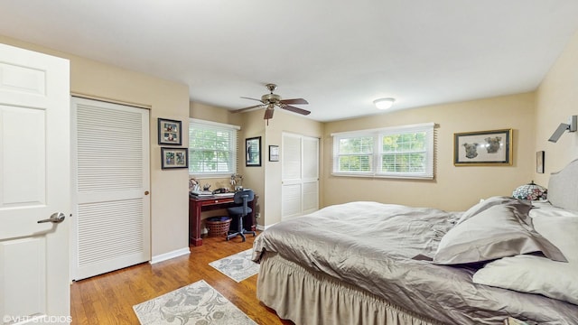 1502 S Fernandez Ave, Arlington Heights, IL 60005 - bedroom with multiple closets, multiple windows, wood finished floors, and ceiling fan