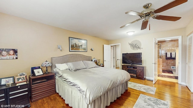 1502 S Fernandez Ave, Arlington Heights, IL 60005 - bedroom featuring wood finished floors, ensuite bathroom, and ceiling fan