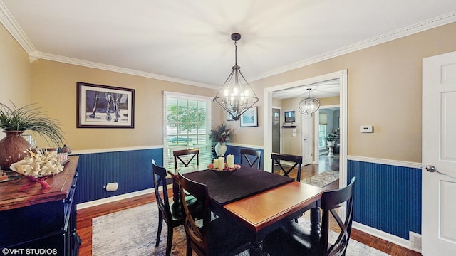 1502 S Fernandez Ave, Arlington Heights, IL 60005 - dining space featuring wood finished floors, a chandelier, crown molding, and wainscoting