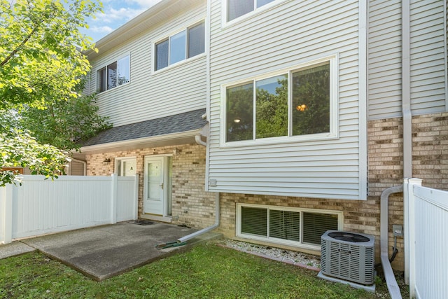392 Park Ridge Ln Unit B, Aurora, IL 60504 - rear view of property with brick siding and roof with shingles