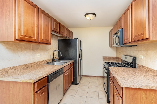 392 Park Ridge Ln Unit B, Aurora, IL 60504 - kitchen with appliances with stainless steel finishes, backsplash, light countertops, and brown cabinets