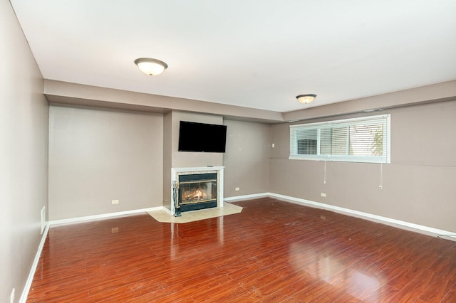 392 Park Ridge Ln Unit B, Aurora, IL 60504 - unfurnished living room featuring a fireplace with flush hearth and wood finished floors
