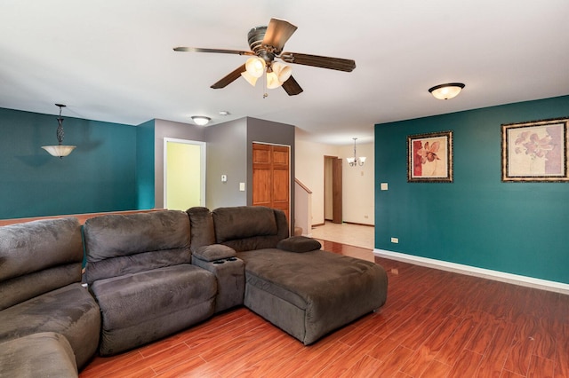 392 Park Ridge Ln Unit B, Aurora, IL 60504 - living area with a ceiling fan, light wood finished floors, stairs, and a chandelier