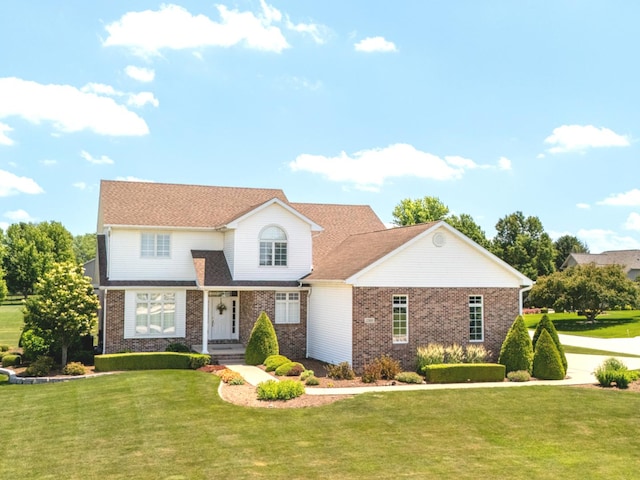 2305 Fox Run Dr, Kankakee, IL 60901 - traditional home featuring brick siding and a front yard