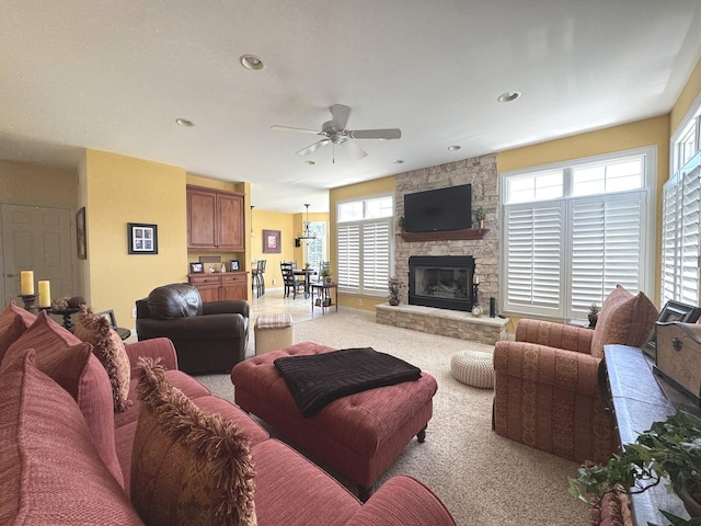 2305 Fox Run Dr, Kankakee, IL 60901 - living area with ceiling fan, a stone fireplace, recessed lighting, and light carpet