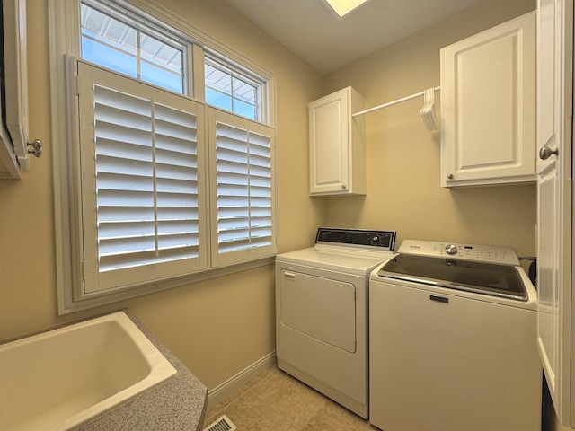 2305 Fox Run Dr, Kankakee, IL 60901 - washroom with separate washer and dryer, cabinet space, and light tile patterned floors