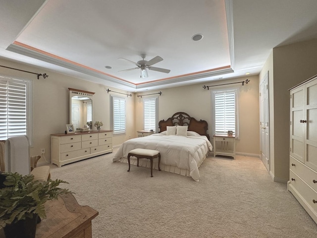 2305 Fox Run Dr, Kankakee, IL 60901 - bedroom featuring a tray ceiling, multiple windows, and light carpet