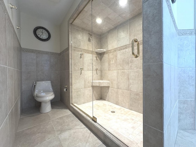 2305 Fox Run Dr, Kankakee, IL 60901 - bathroom featuring a shower stall, tile patterned flooring, and tile walls