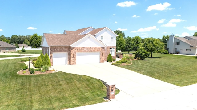 2305 Fox Run Dr, Kankakee, IL 60901 - traditional-style home featuring brick siding, concrete driveway, a garage, and a front lawn