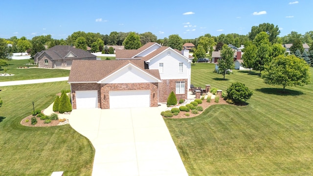 2305 Fox Run Dr, Kankakee, IL 60901 - traditional-style home featuring a garage, concrete driveway, a front yard, and brick siding
