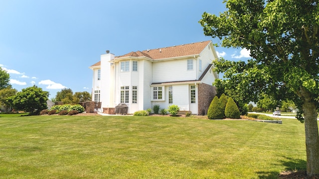 2305 Fox Run Dr, Kankakee, IL 60901 - rear view of house featuring a chimney and a yard