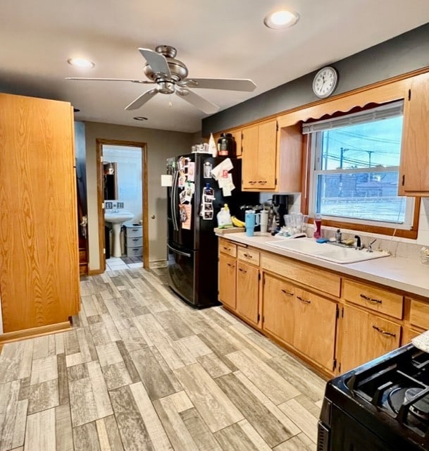 6359 W 63rd Pl, Chicago, IL 60638 - kitchen with black appliances, light countertops, a ceiling fan, light wood-style floors, and recessed lighting