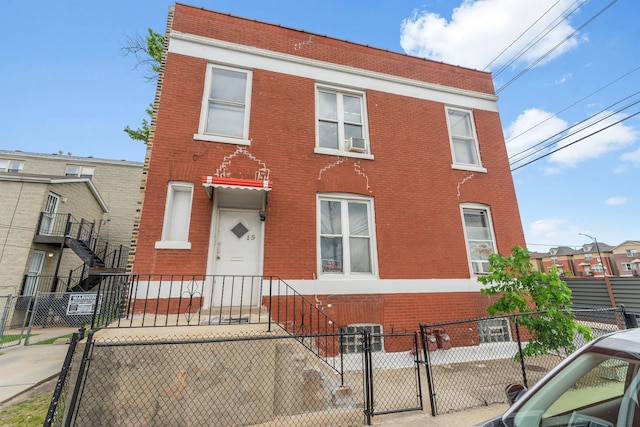 15 N Washtenaw Ave, Chicago, IL 60612 - multi unit property with a gate, brick siding, and a fenced front yard