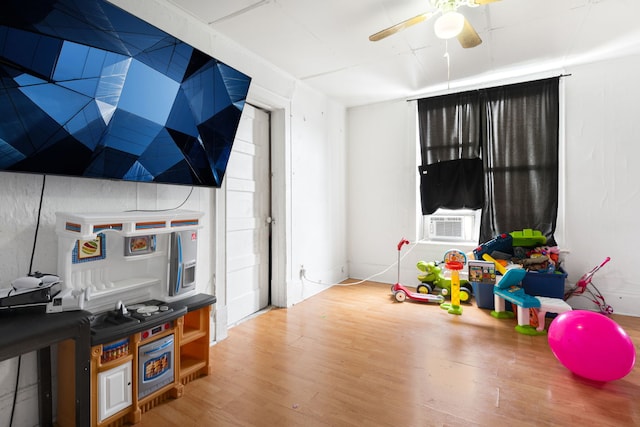 15 N Washtenaw Ave, Chicago, IL 60612 - rec room with wood finished floors, ceiling fan, and cooling unit