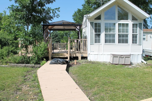 183 Fossil Cove Ct, Wilmington, IL 60481 - view of side of property with a gazebo, a yard, and a deck