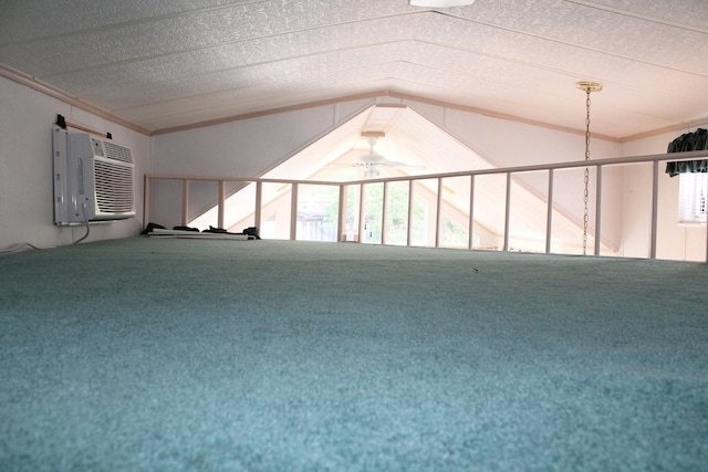 183 Fossil Cove Ct, Wilmington, IL 60481 - carpeted spare room with ceiling fan, ornamental molding, an AC wall unit, and vaulted ceiling