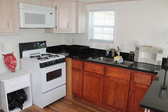 183 Fossil Cove Ct, Wilmington, IL 60481 - kitchen with white appliances, dark wood-style floors, brown cabinetry, and dark stone countertops