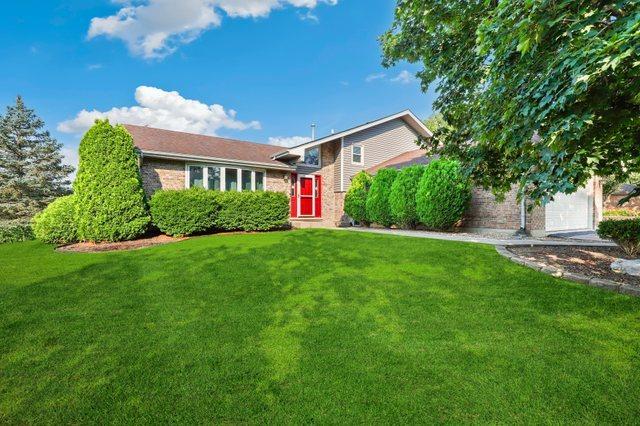 12133 Black Pine Trl, Homer Glen, IL 60491 - view of front of house with a front lawn and brick siding