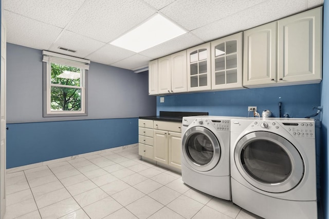 12133 Black Pine Trl, Homer Glen, IL 60491 - laundry area with cabinet space, washing machine and clothes dryer, and light tile patterned floors